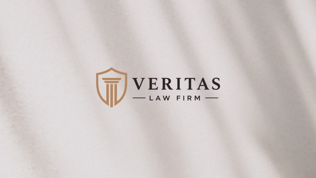 Veritas Law Firm primary logo design on a dark background